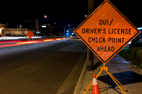DUI checkpoint sign at night